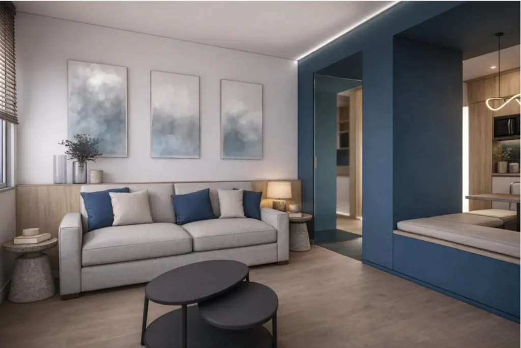 Suite premium du projet IBIS à Mougins avec salon contemporain, espace optimisé, mobilier intégré et ambiance élégante signée Intérieurs à Croquer