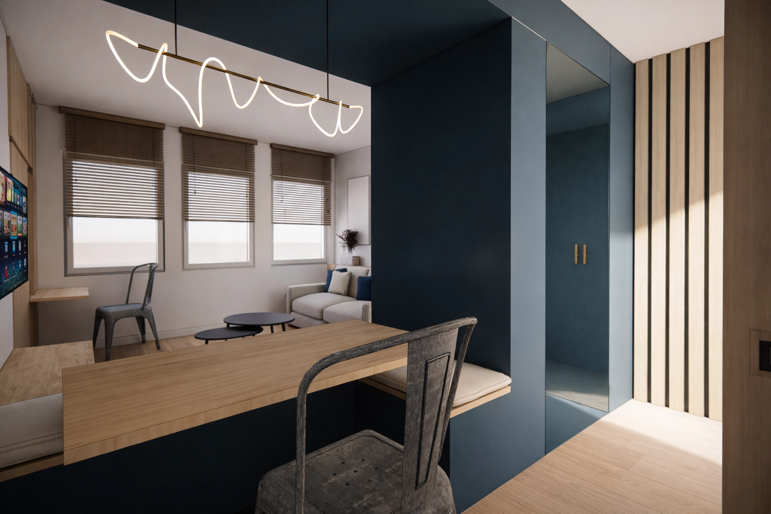 Vue depuis la cuisine vers le salon dans la suite premium du projet IBIS à Mougins avec volume central et agencement fluide signé Intérieurs à Croquer
